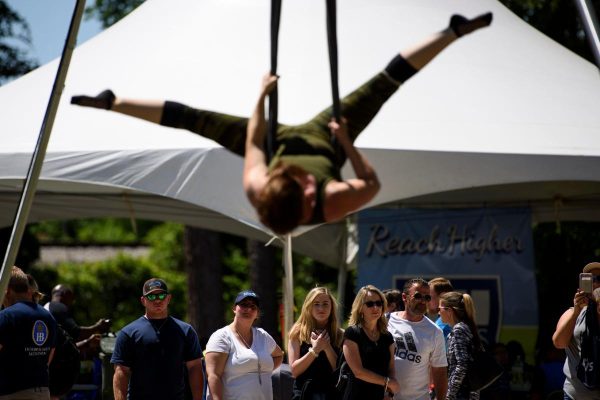 Guests of the Dogwood Festival watch as Crystal Butler performs a routine as a member of Airborne Aerial Fitness and Arts group on April 27, 2019 at the annual Dogwood Festival. The group offers fitness classes using aerial techniques as well as performing in public.